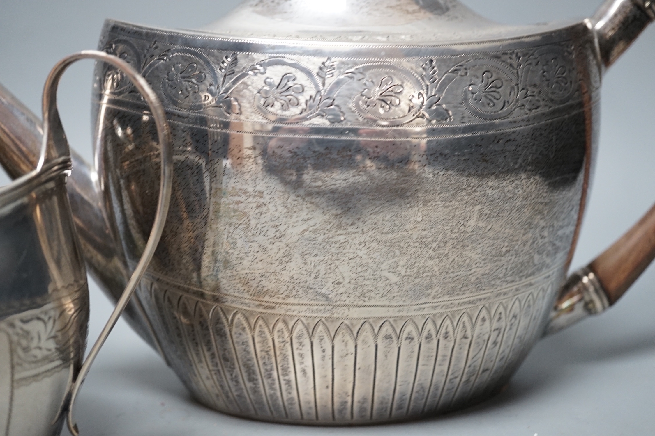 A 1930's engraved silver oval three piece tea set, S. Blanckensee & Sons Ltd, Chester, 1936/7, gross weight 26.5oz.